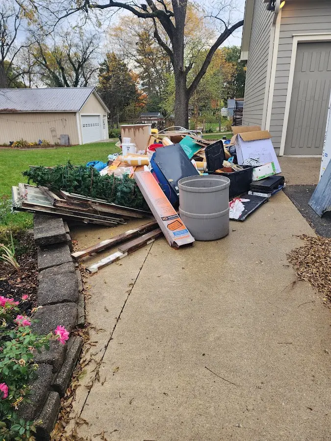 Dumpster being loaded with debris for 3 Yard Dumpster Rental in Covington